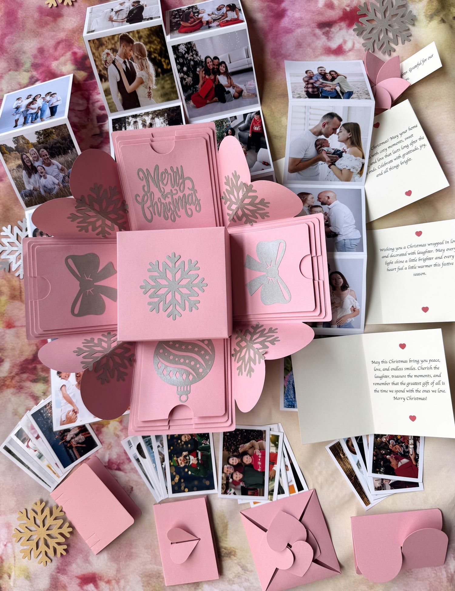 Top-view hero image of pink Christmas explosion gift box with closed lid.