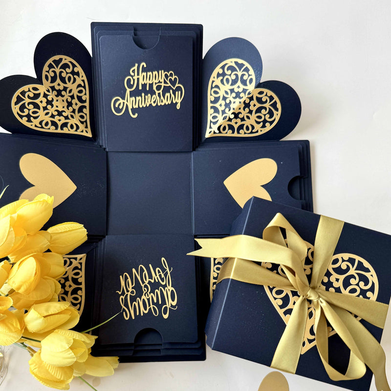 Black and gold anniversary explosion gift box with elegant ribbon wrapped, close up view