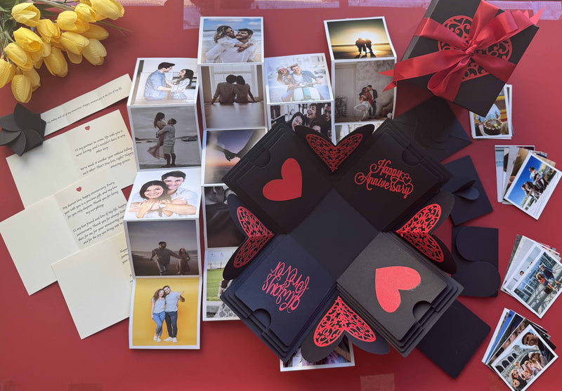 Open black and red explosion box for anniversary, revealing personalized photo layers and romantic messages