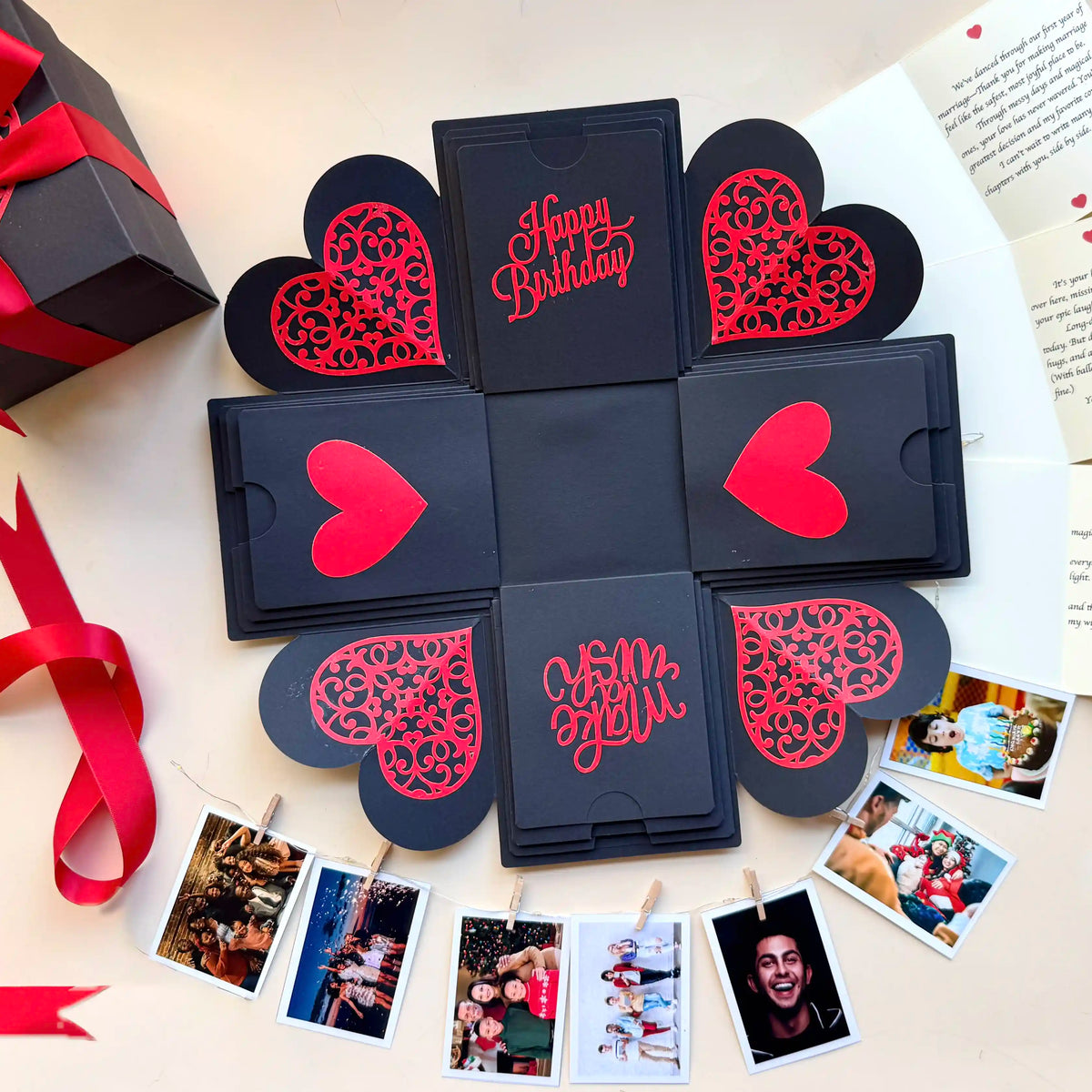 Top view of black red birthday explosion gift box with layered square panels