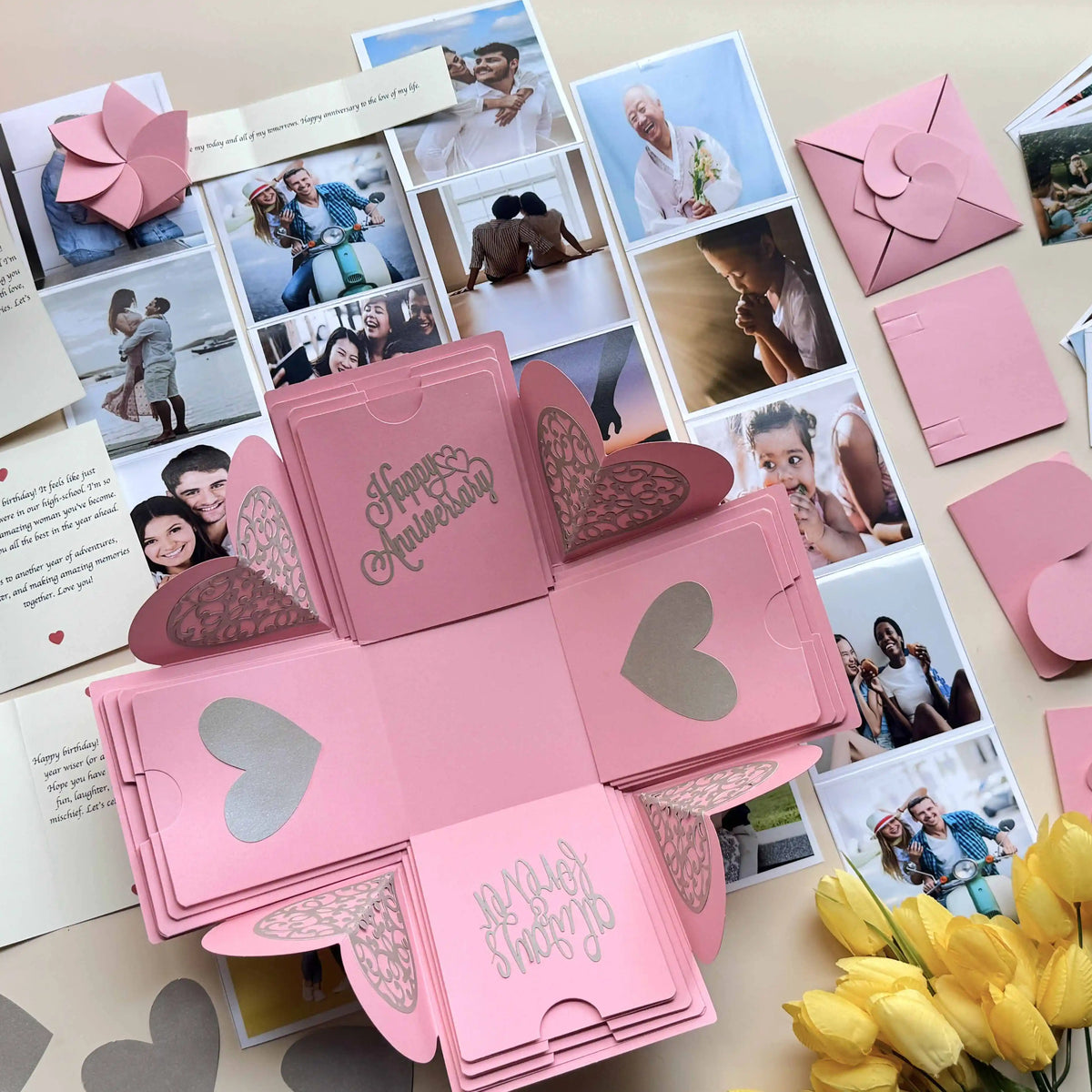 Angled view of open pink explosion gift box with photos on all four panels