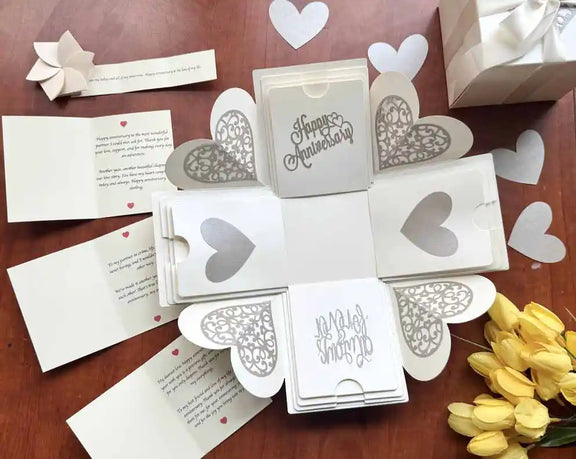 Detailed shot of white explosion gift box folds with photos and micro note