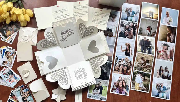 White anniversary explosion gift box with origami photo pockets, top-down view