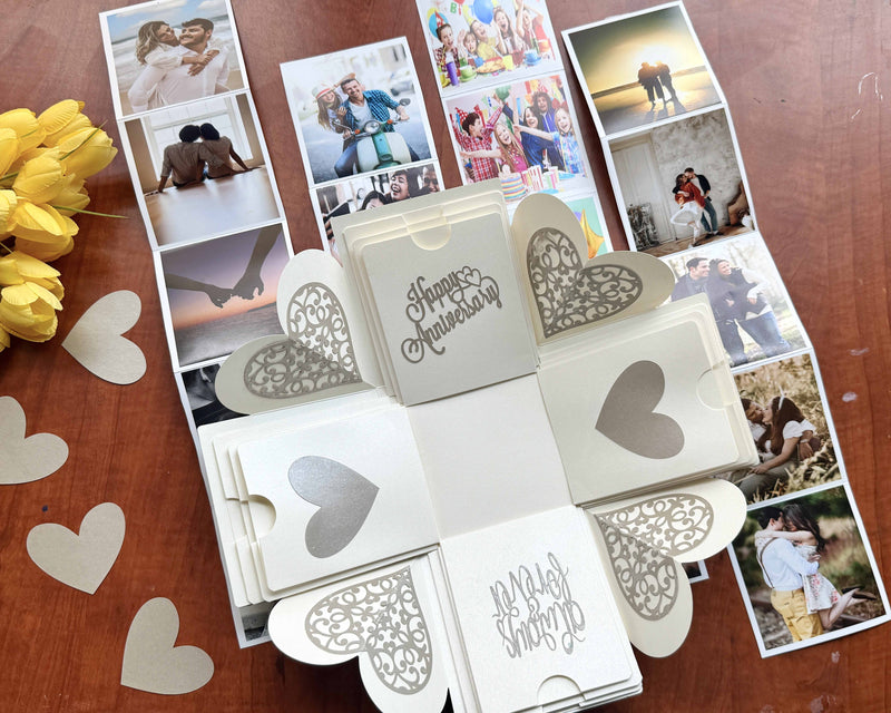 Anniversary explosion gift box with customized pull-out albums - decorated with paper hearts and flowers 