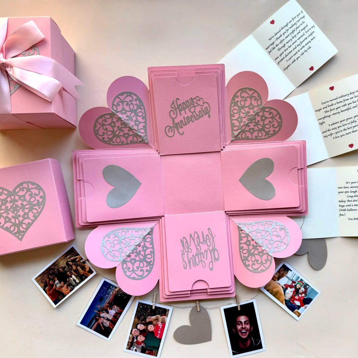 Close-up shot of pink explosion gift box highlighting personalized message cards