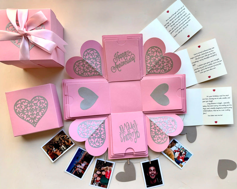 Close-up shot of pink explosion gift box highlighting personalized message cards