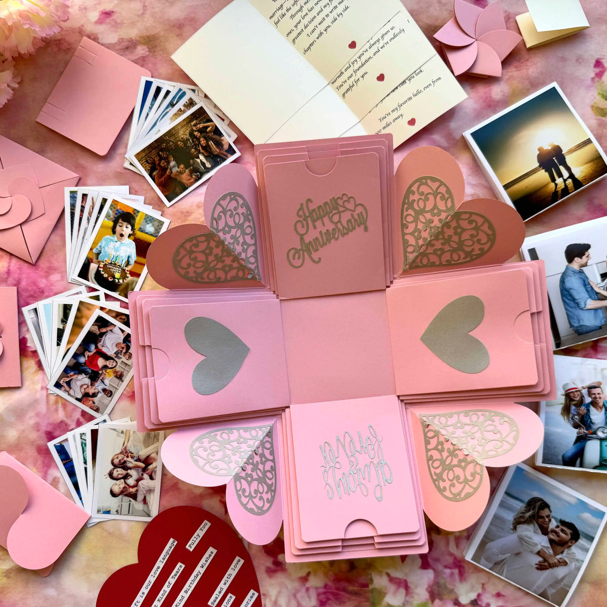 Top view of pink explosion gift box before opening, anniversary gift presentation