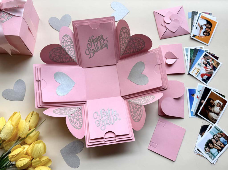Explosion gift box for birthdays in pink color with customized photos organized in designer folder - Catalog photo - top view
