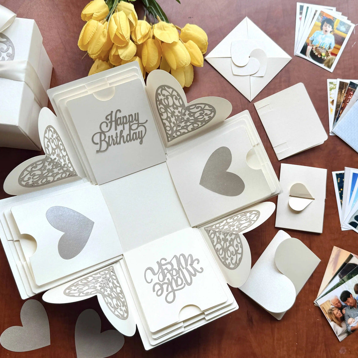 Close-up detail of white birthday explosion gift box showing paper layers and craftsmanship