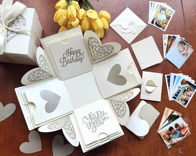 Close-up detail of white birthday explosion gift box showing paper layers and craftsmanship