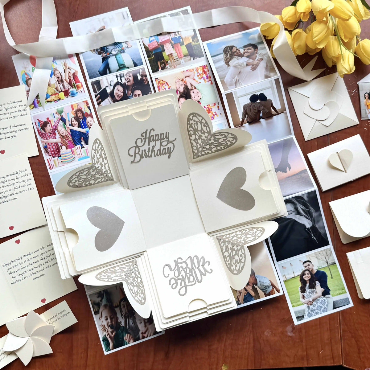 White birthday explosion gift box opened with personalized message cards