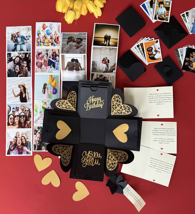 Black and gold birthday explosion box showcasing a message layer, personalized pull-out photo albums, and wallet-size picture options.