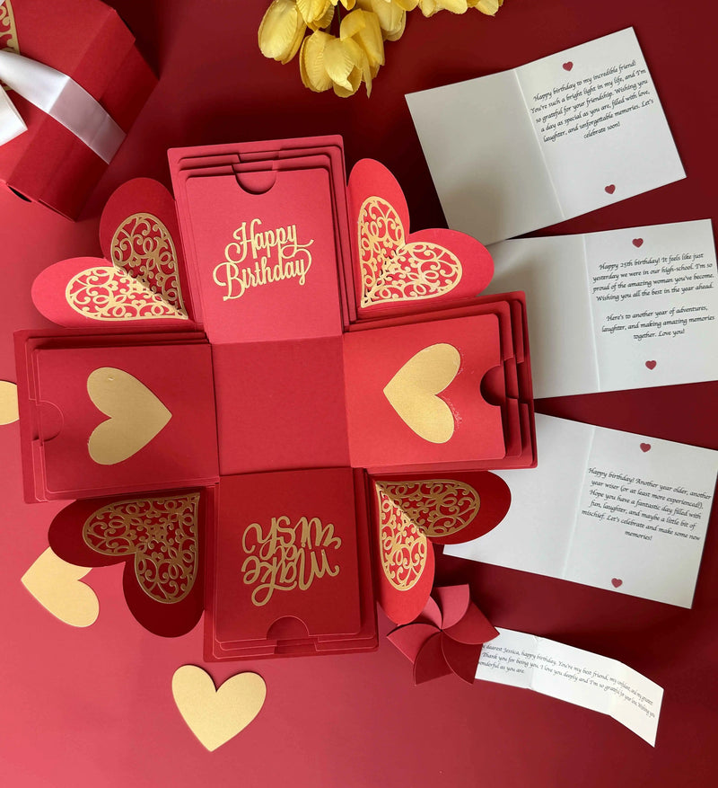 Angled view of red birthday explosion gift box highlighting photos and message layers