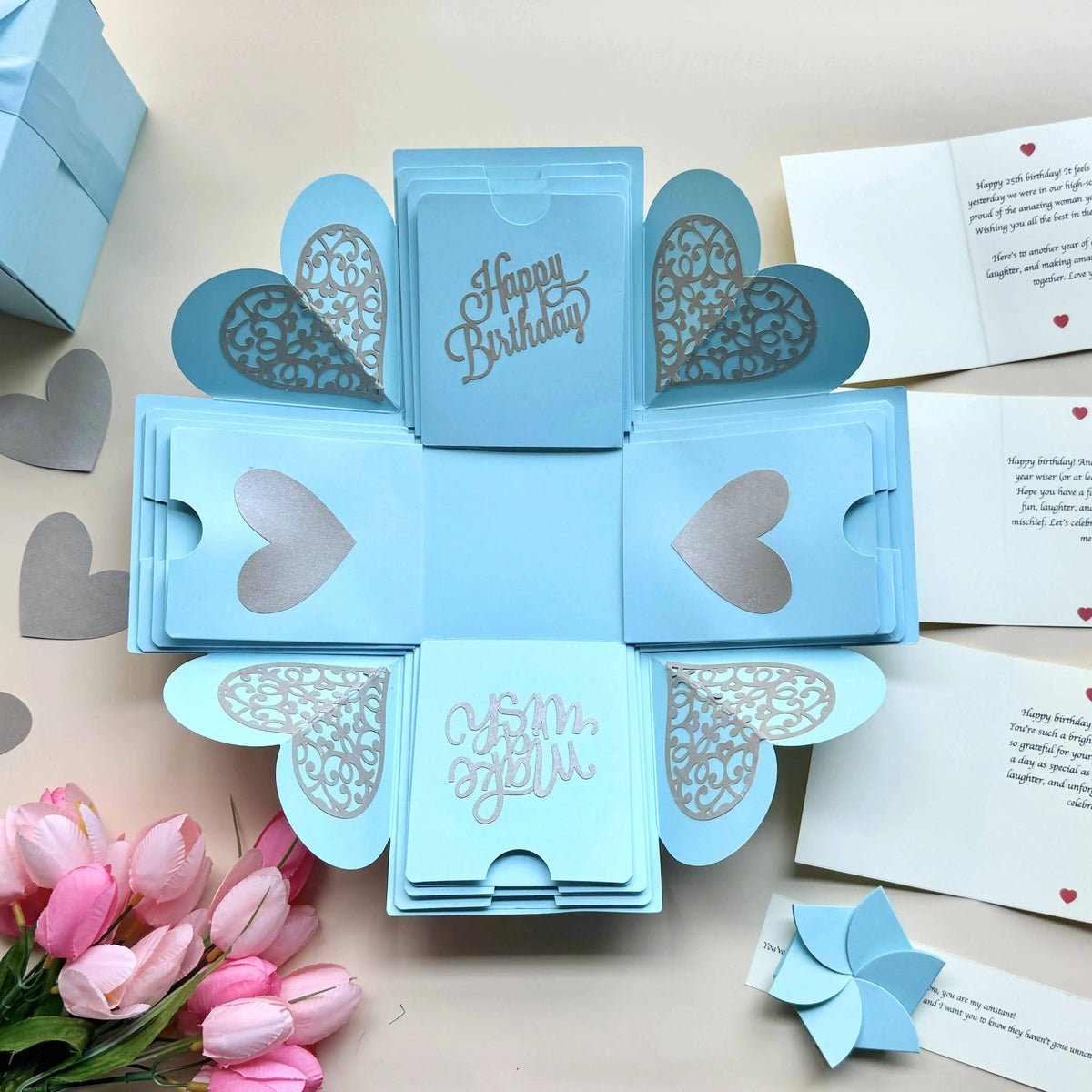 Close-up detail of blue birthday explosion gift box with customized messages