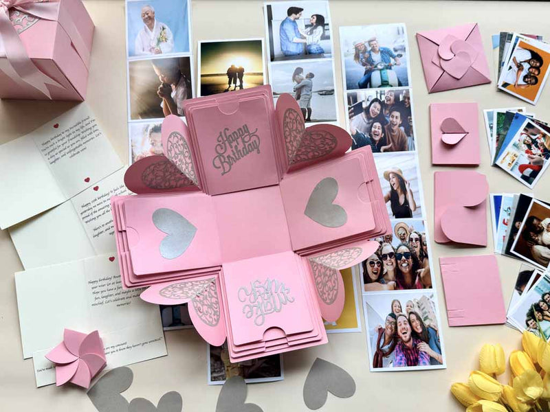 Explosion gift box for birthday - pink color customized with pull-out albums, photos and messages. Product catalog picture with contents displayed.