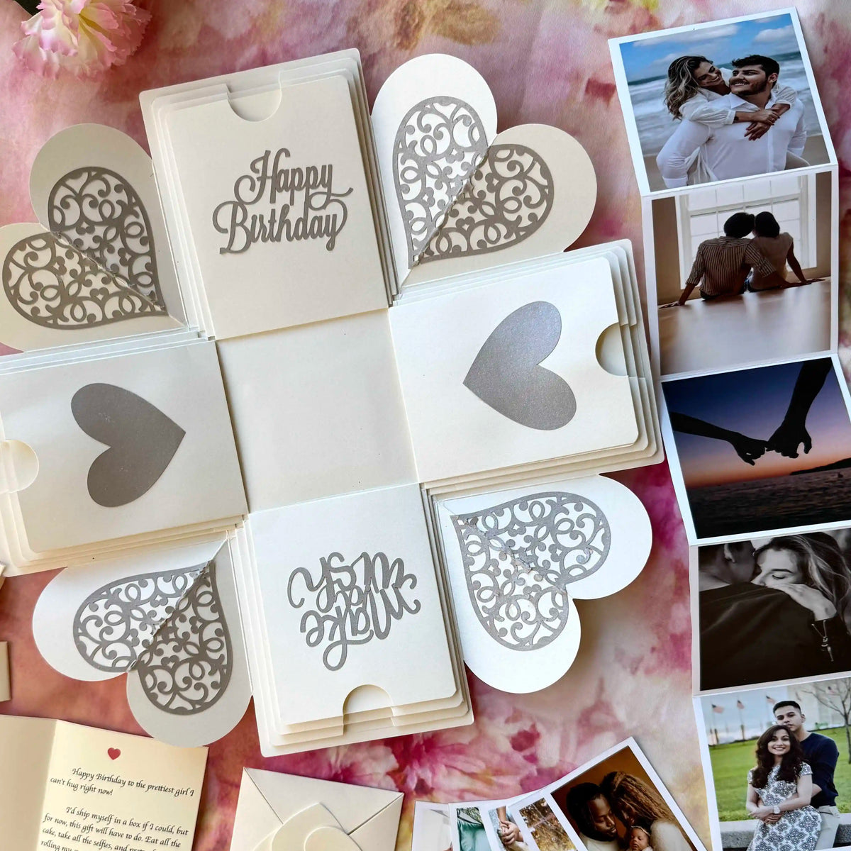 White birthday explosion gift box opened displaying custom photo inserts