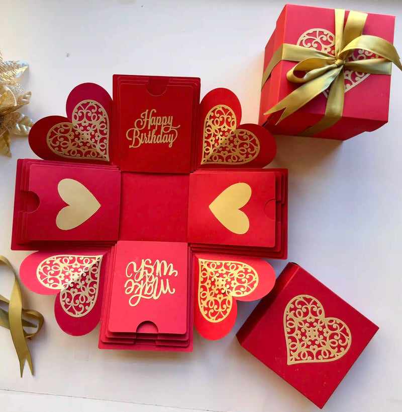 Red birthday explosion gift box closed, ribbon-wrapped and ready to gift