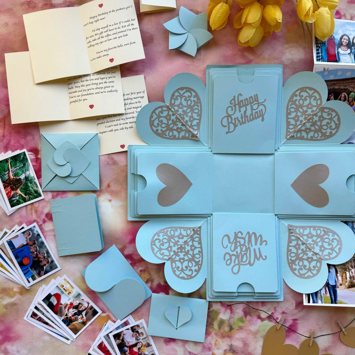 Top view of blue birthday explosion gift box with layered square design