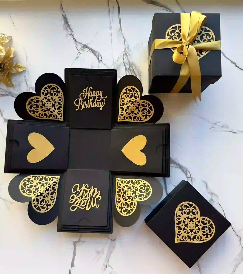 Top view of black and gold birthday explosion gift box before opening