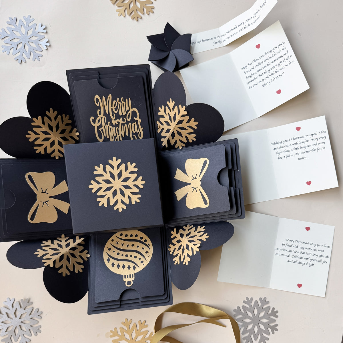 Top-view hero image of black Christmas explosion gift box with closed lid.