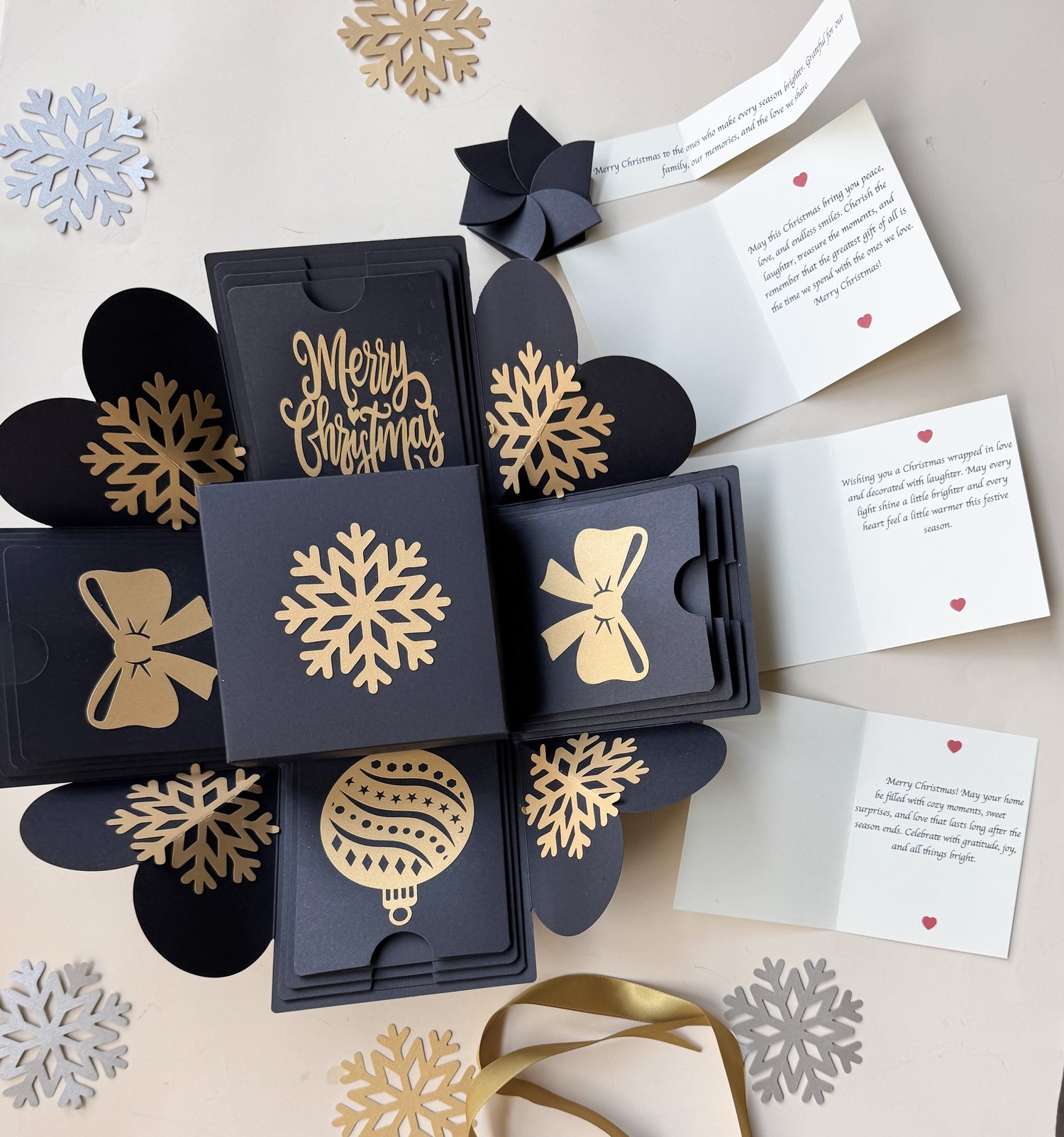 Top-view hero image of black Christmas explosion gift box with closed lid.