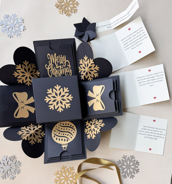 Top-view hero image of black Christmas explosion gift box with closed lid.