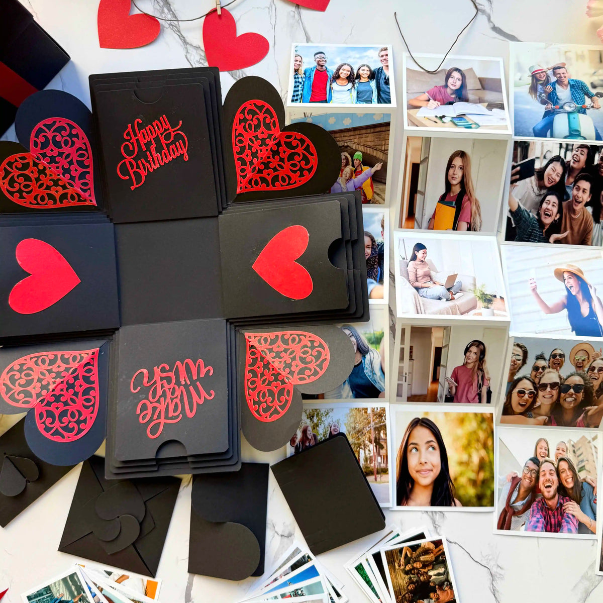 Black and Red birthday explosion gift box opened flat, showing photos and message cards