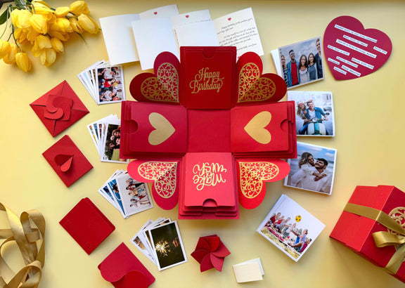 Red and Gold Birthday Explosion Gift Box – Mega Surprise edition with multiple photo pull-out albums, secret message layers, and a luxurious red-gold theme for a grand birthday reveal. 