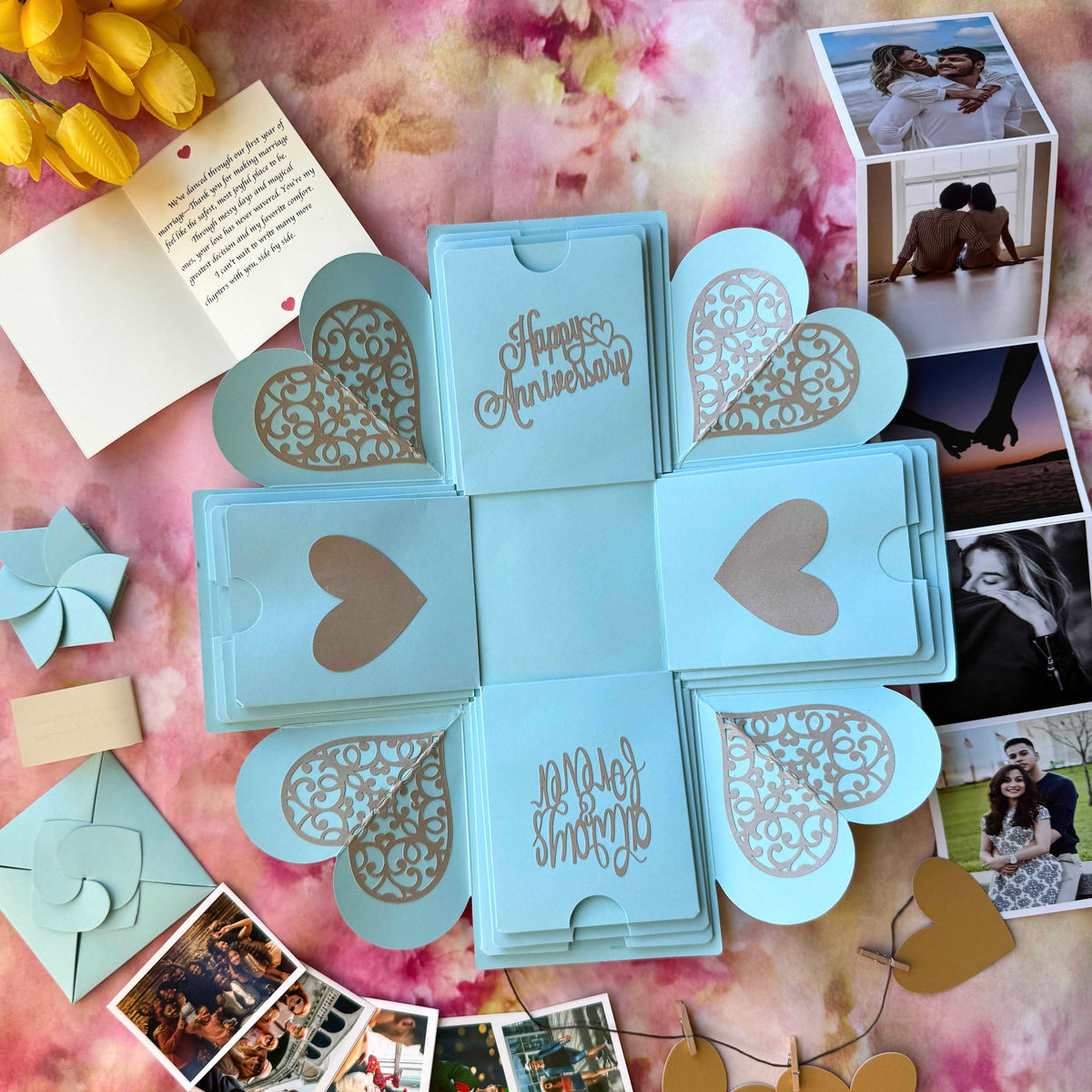 Blue Anniversary Explosion Gift Box – a handcrafted keepsake with elegant blue and gold accents, featuring folded layers that open to reveal photos and heartfelt anniversary messages.