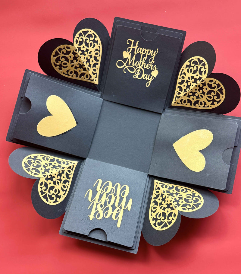 Black and gold Mother's Day explosion box with contents inside