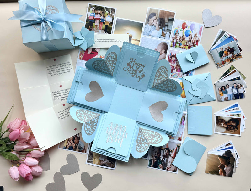 Explosion gift box for mother's day with personalized albums, photos and messages. Product title photo decorated with flowers and paper hearts.   