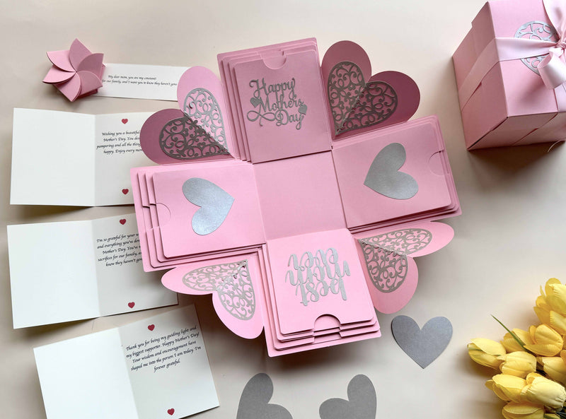 Mother's day explosion gift box with personalized messages and wishes - wrapped in pink ribbon - product photo with hearts and flower 