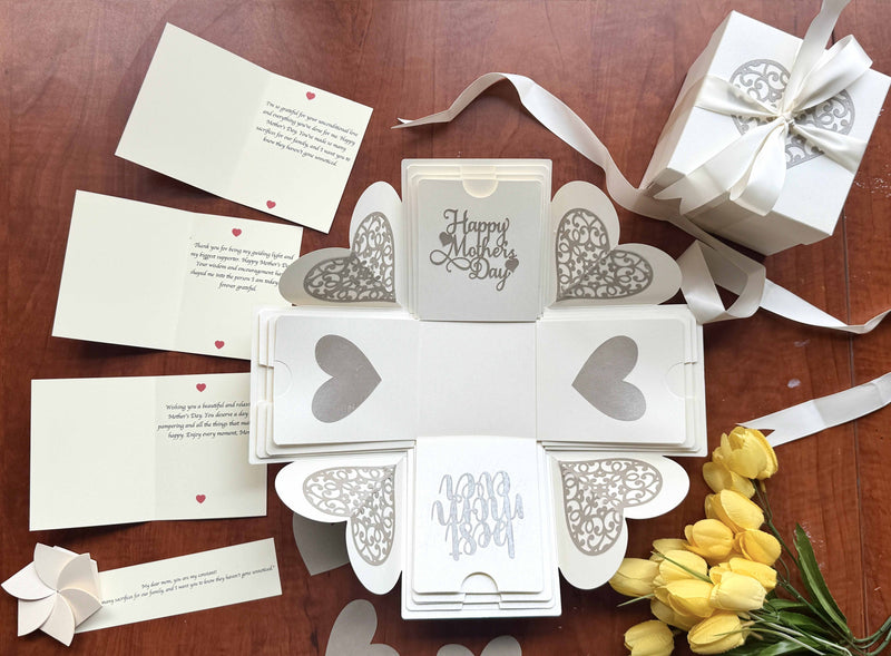 Explosion gift box for Mother's Day White color decorated with ribbons - Personalized messages and wishes - flat-lay click with hearts and flowers