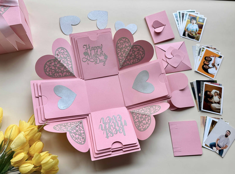 Mother's day explosion gift box pink with customized wallet-size photos organized in folders - top view