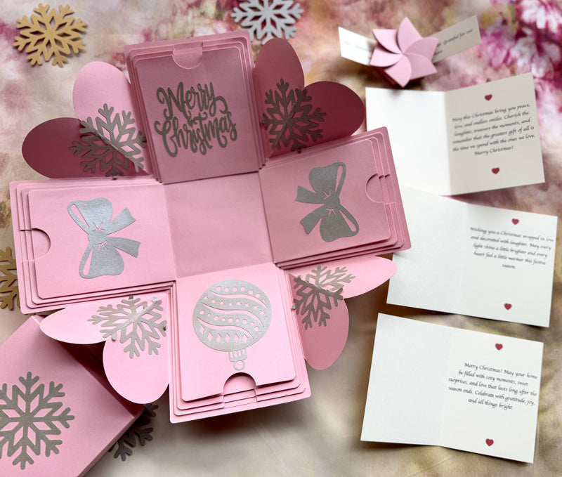 Angled shot of pink Christmas explosion gift box in the mini surprise version.