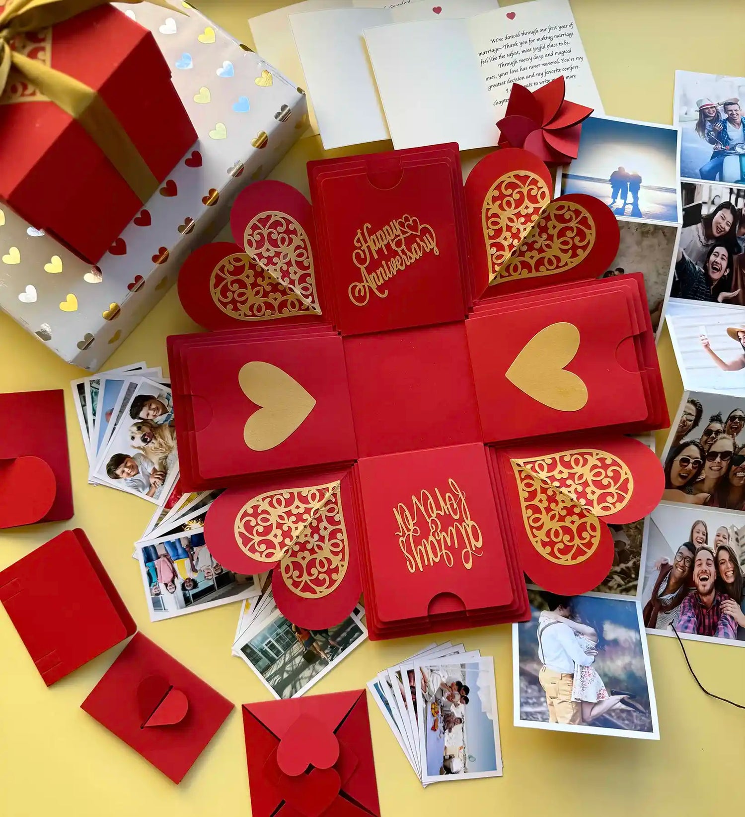 Red anniversary explosion gift box with layered panels and personalized photo inserts
