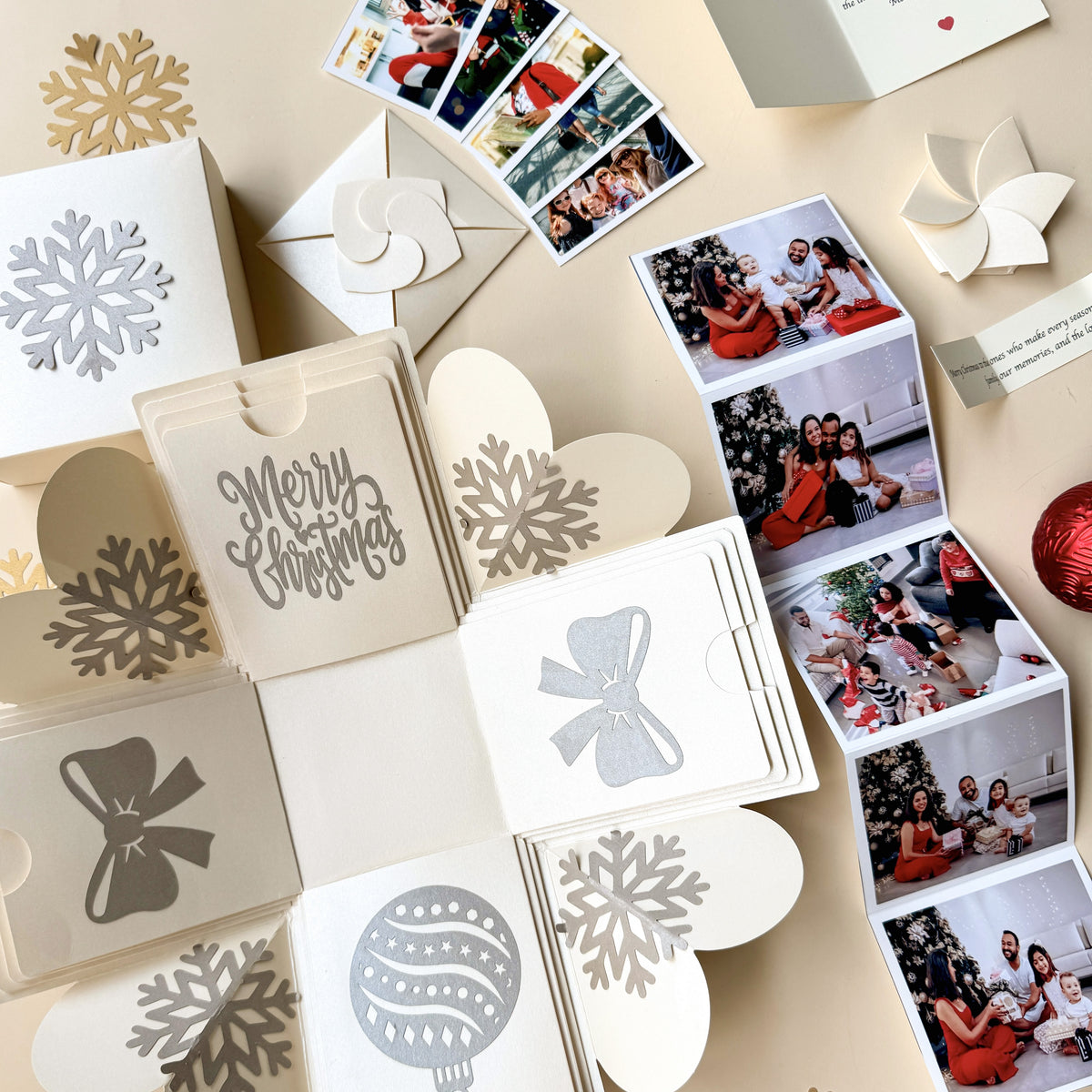 Top-view explosion gift box showing extended pull-out photo albums.