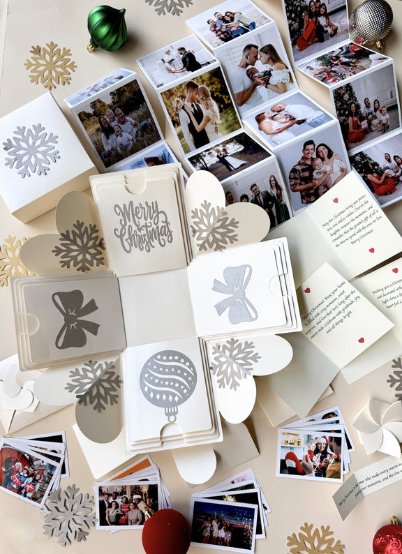 Close-up of explosion gift box with origami photo pockets unfolded.