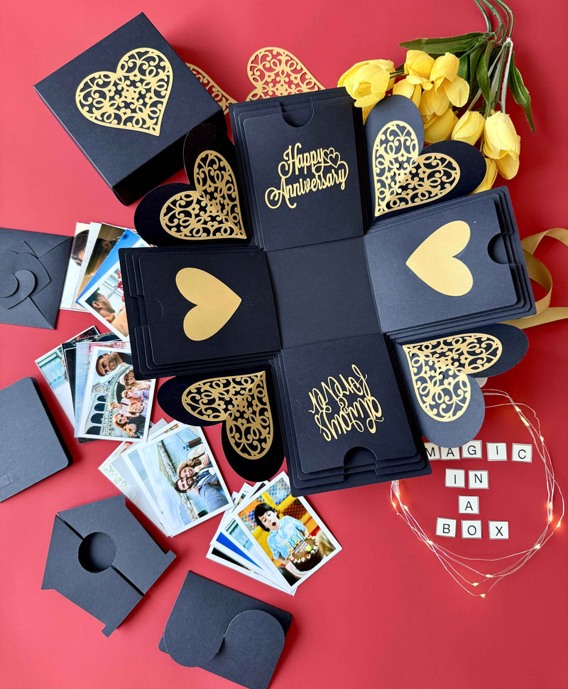 Close-up of message layer inside black and gold explosion gift box with personalized anniversary note