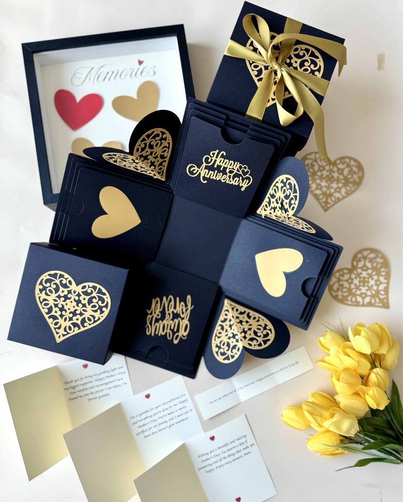 Close-up of message layer inside black and gold explosion gift box with personalized anniversary note