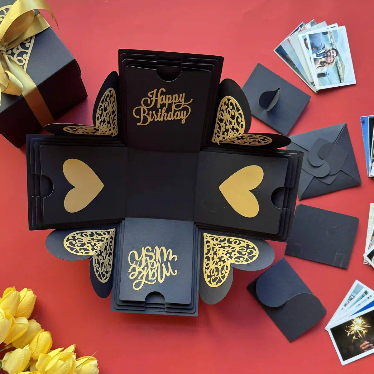 Black gold birthday explosion gift box opened displaying custom photo inserts