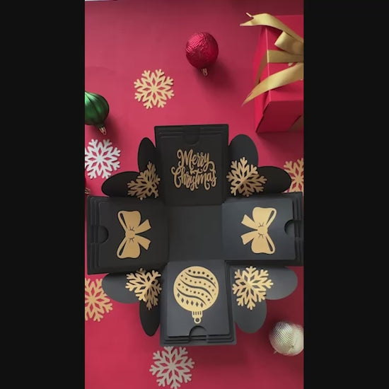 Demo video showing black Christmas explosion gift box unboxing with layers opening and inserts displayed.