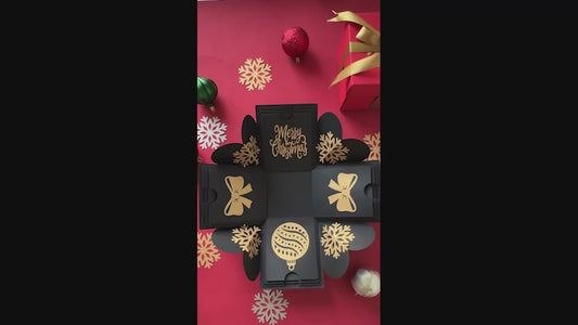Demo video showing black Christmas explosion gift box unboxing with layers opening and inserts displayed.