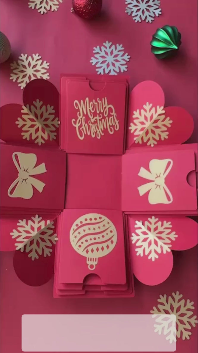 Red Christmas explosion gift box unboxing video showing photo layers and holiday surprise.