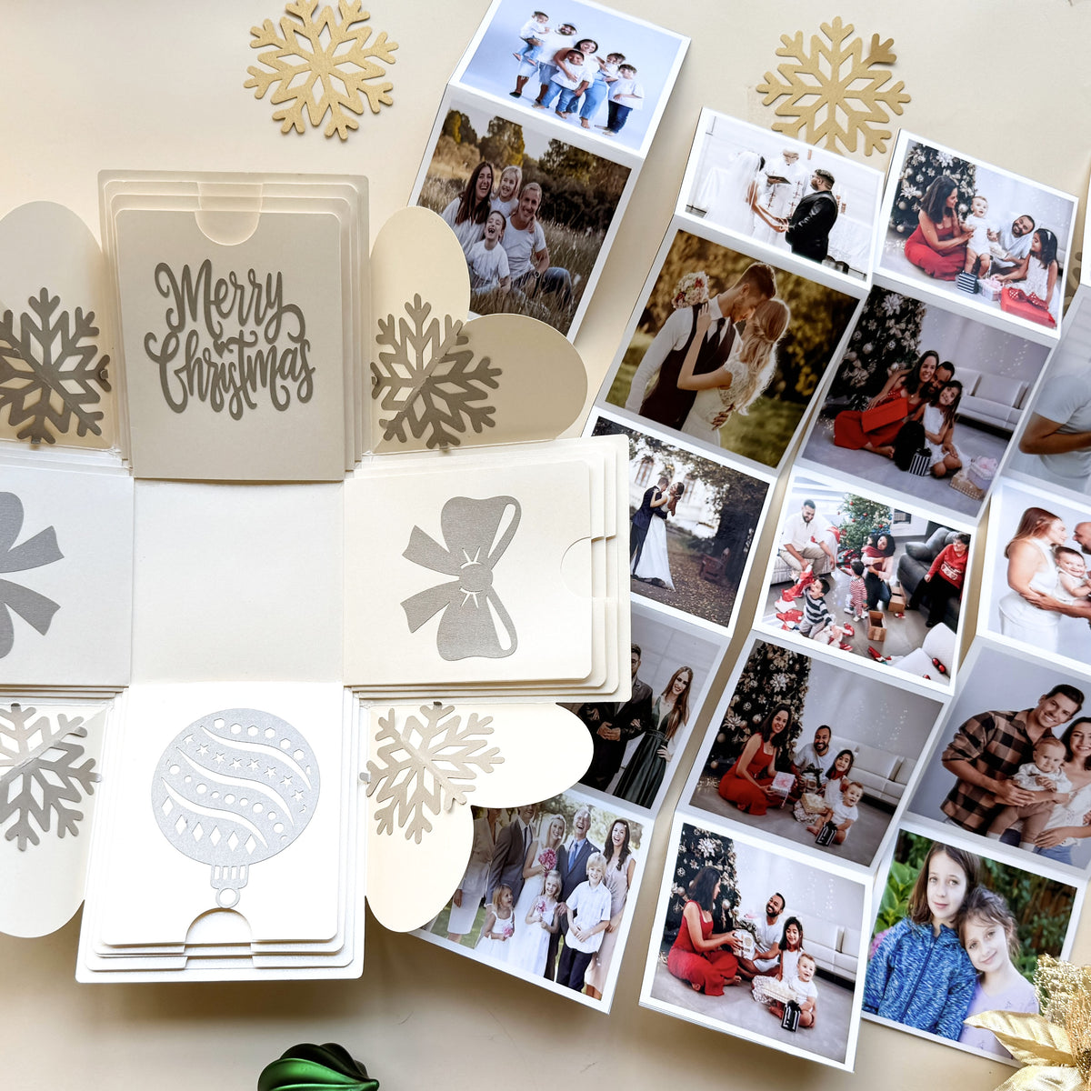 Flat lay of explosion gift box opened with contents spread around it.